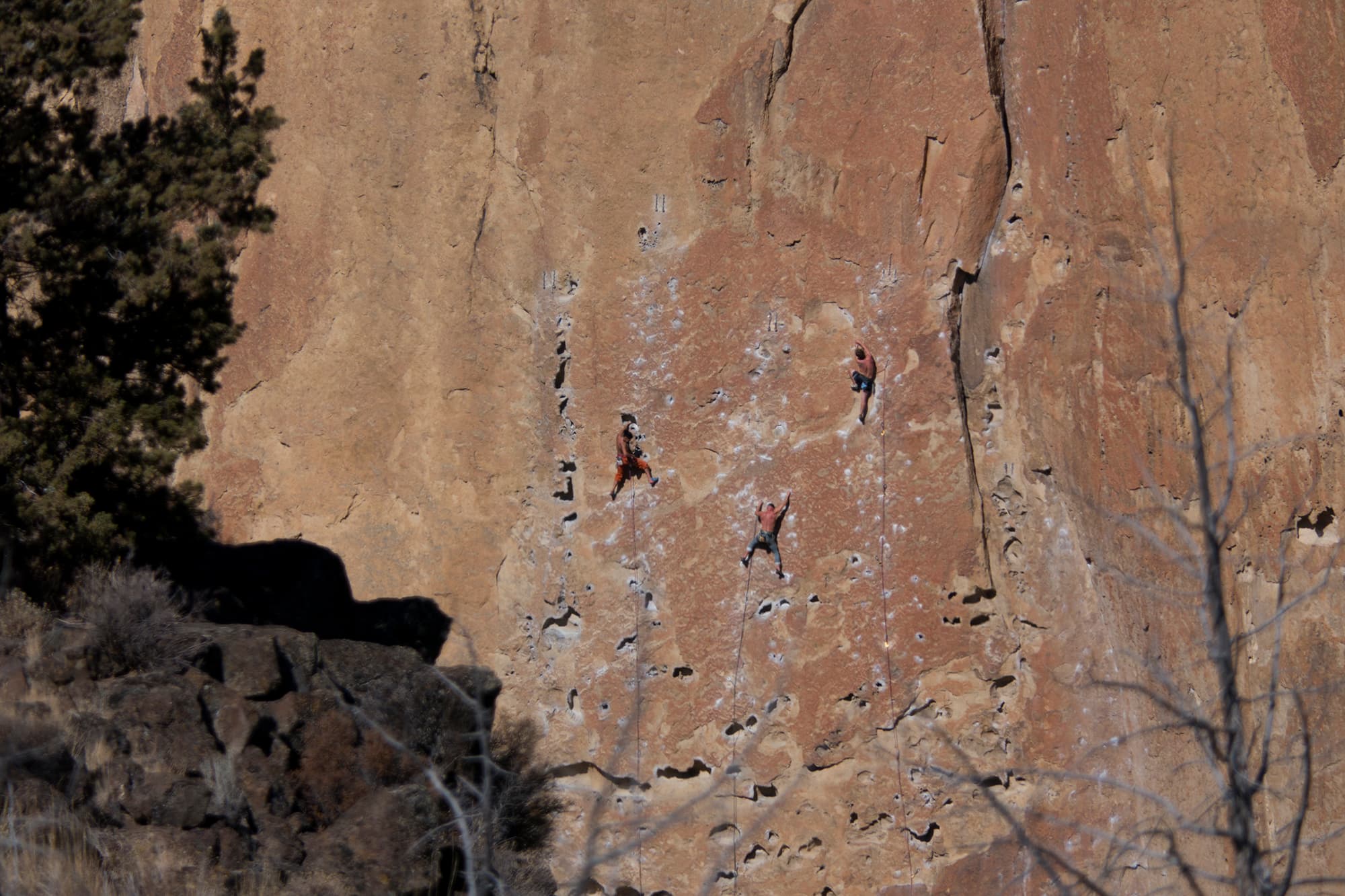 Climbers on a sandstone wall at Smith Rock State Park